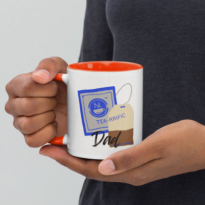 Person holding a mug with 'TEA-RRIFIC Dad' design on a plain White background.