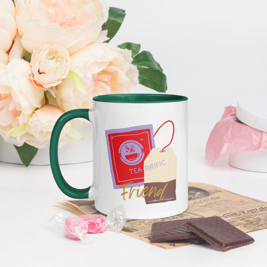 White Tea-riffic Friend mug with green handle, unique decorative tea bag design on white background.