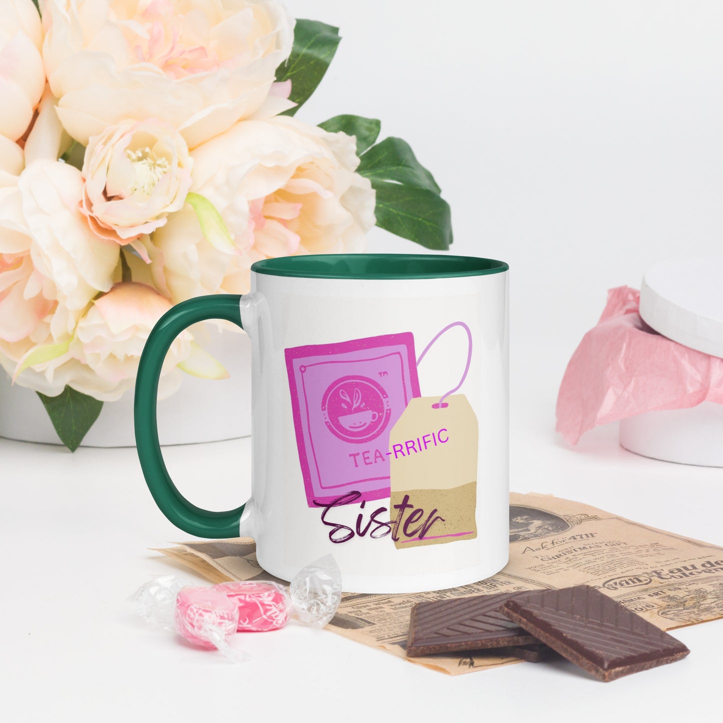 Tea-riffic Sister ceramic mug with colourful handle, rim and interior. Unique tea lover design against a backdrop of flowers.